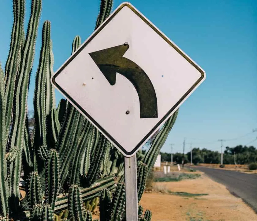 A sign post with a "turn around" arrow