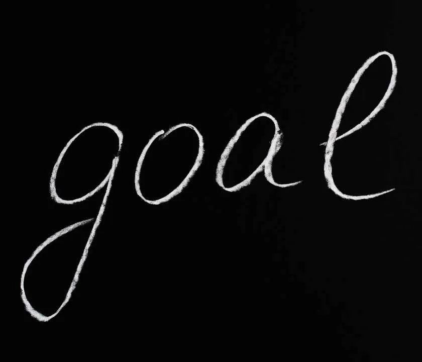 'Goal' written in chalk on a blackboard