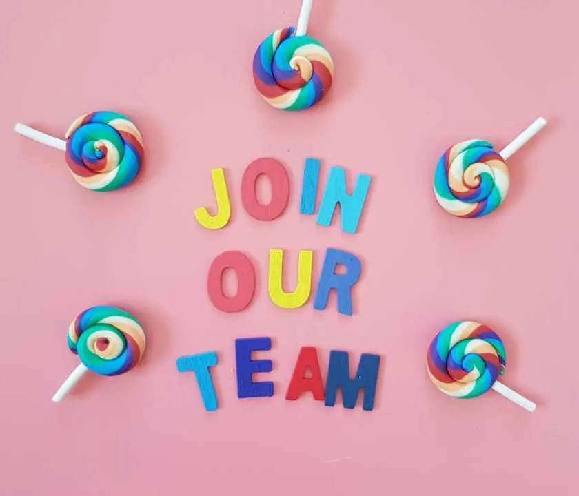 'Join our team' spelt out in fridge magnet letters, surrounded by lollypops